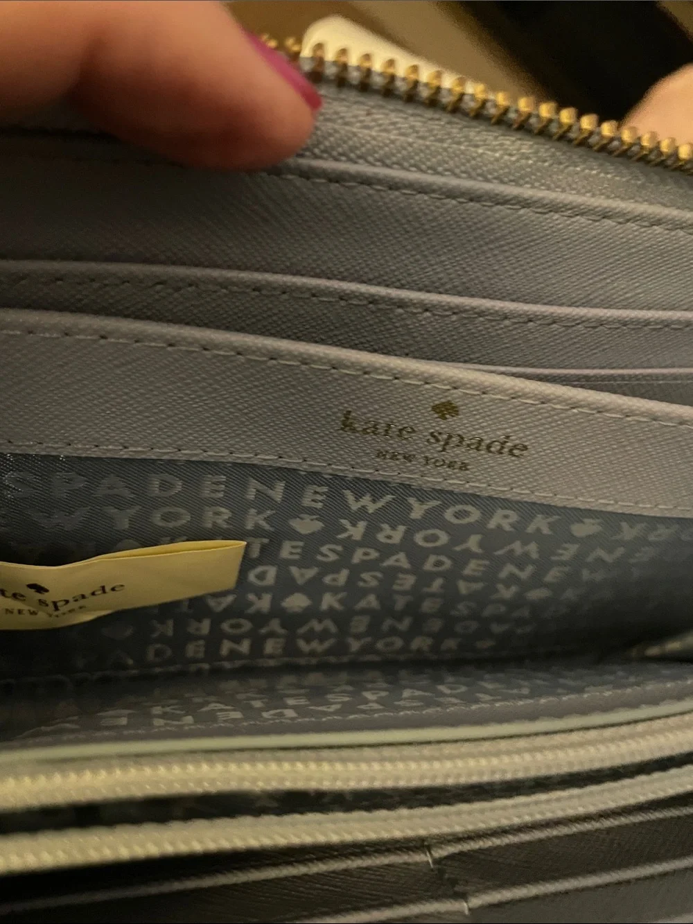 kate spade light blue zip-around wallet with gold plaque